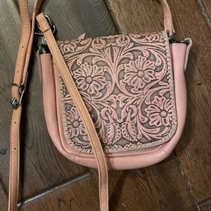 Western style blush pink crossbody purse.